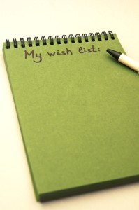 Hand drawing wish list on notebook