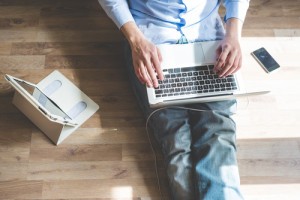 elegant business multitasking multimedia man using devices at home