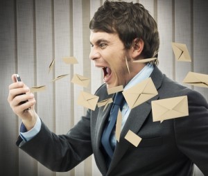 Businessman yelling for too many email received